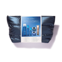 A dark blue puffy kit with 6 pieces of Hydropeptide travel sized products.